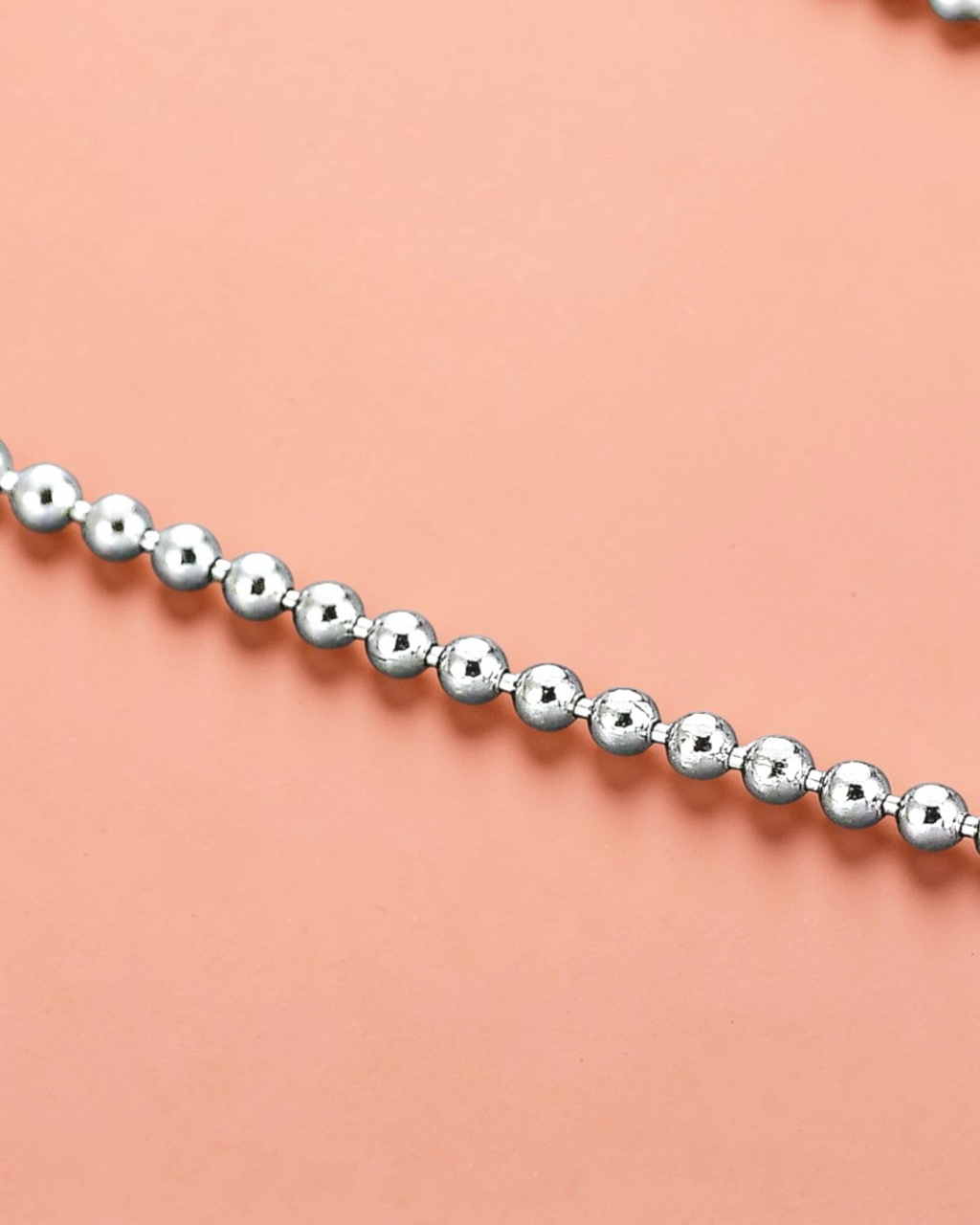 Close-up of a luxurious 2mm ball bead chain made from sterling silver with a polished finish.