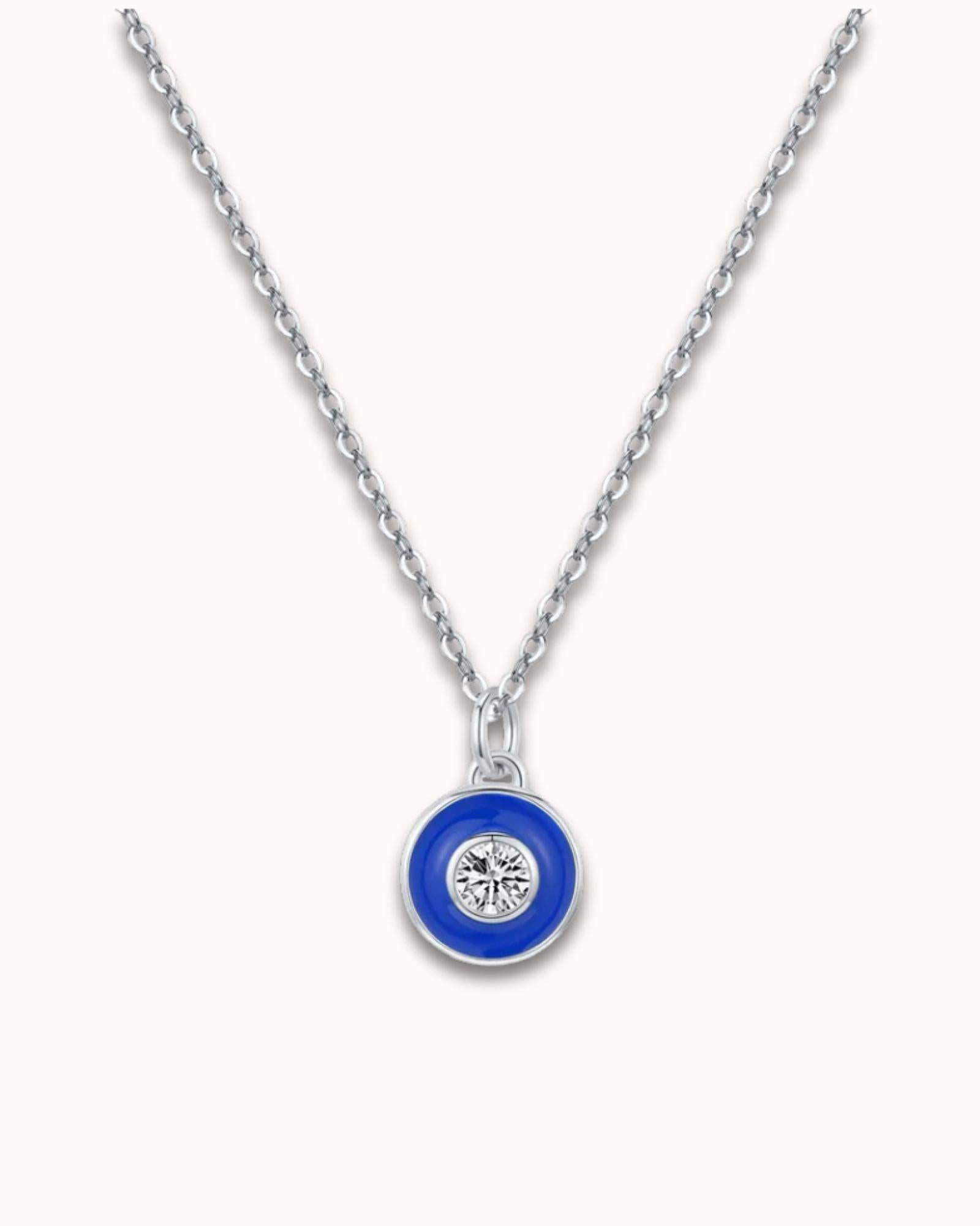 Vintage Devil's Eye pendant necklace featuring a blue motif and diamond on a sterling silver chain.