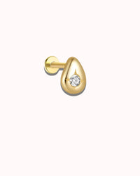Gold earring with a diamond on a white background
