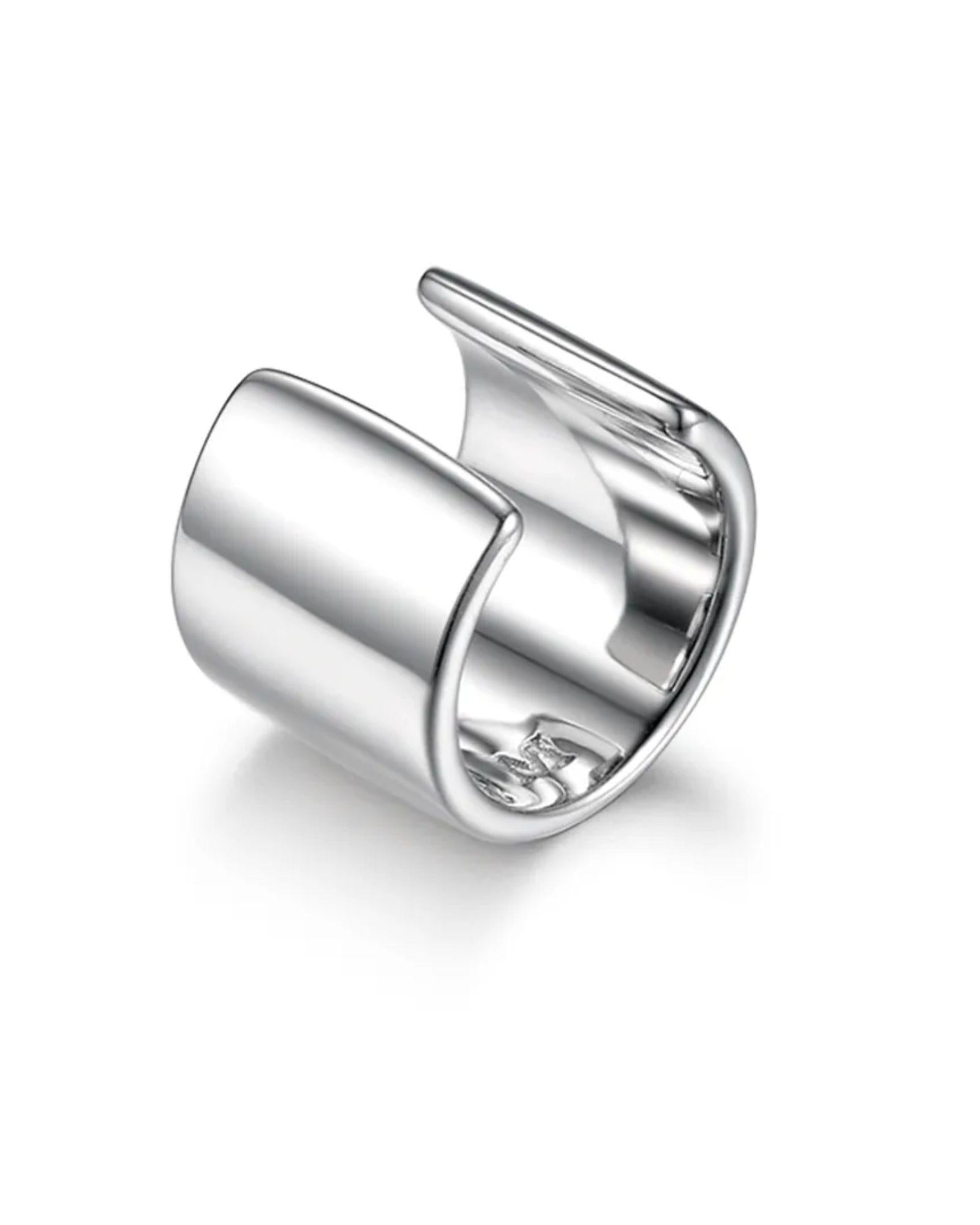Silver ear cuff on a white background