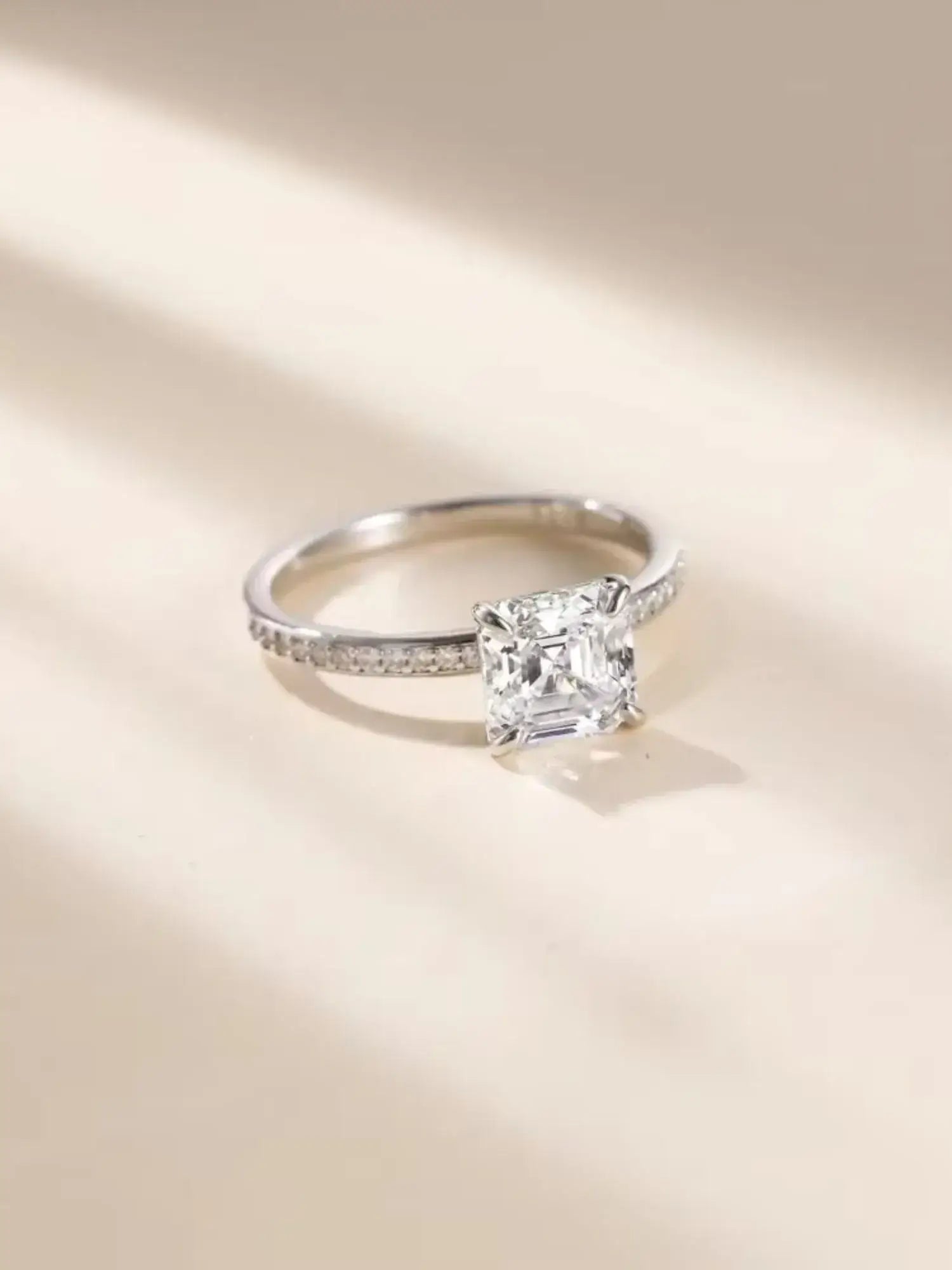 2CT Asscher Cut CZ wedding ring in 925 sterling silver, featuring a sparkling square zirconia and elegant band.