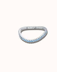 Silver ring with blue gemstones on a white background