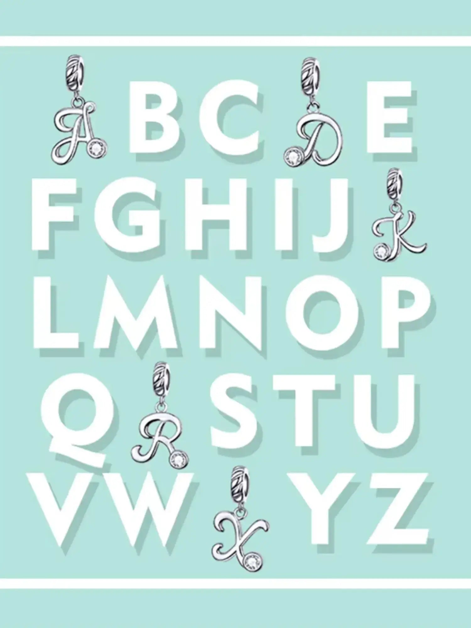 Stylish letter charms in sterling silver displayed on a pastel blue background for personalized jewelry.