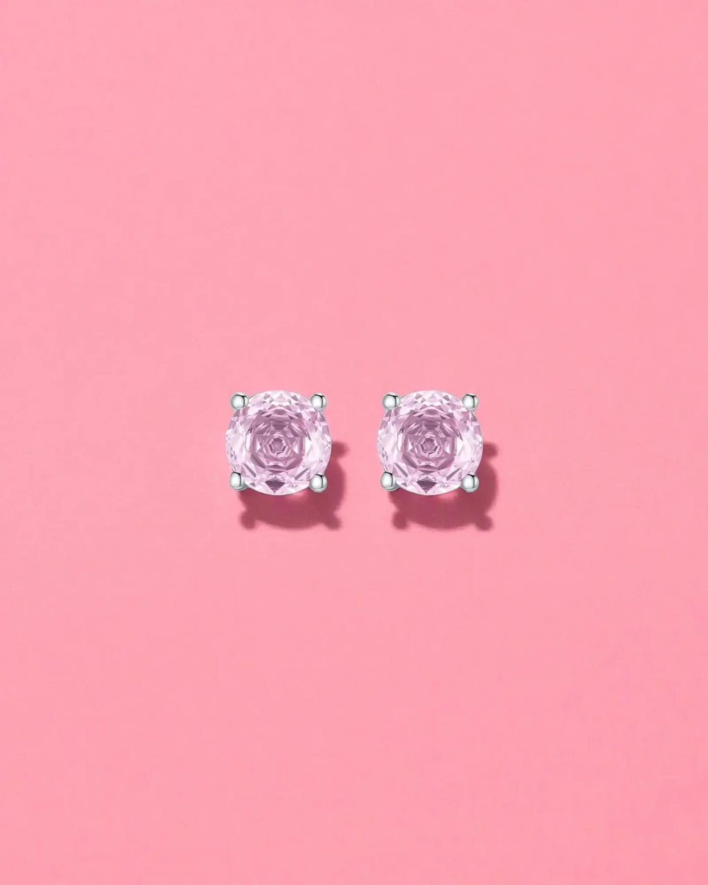 Octagonal Rose Cut Pink Zircon Stud in Silver showcased on a pink background, featuring sparkling pink zirconium stones.