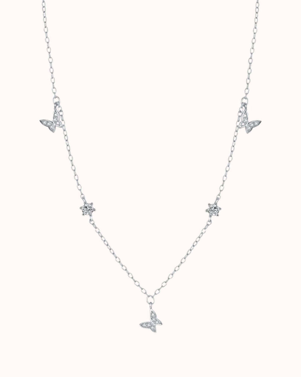 Silver necklace with butterfly pendants on a white background