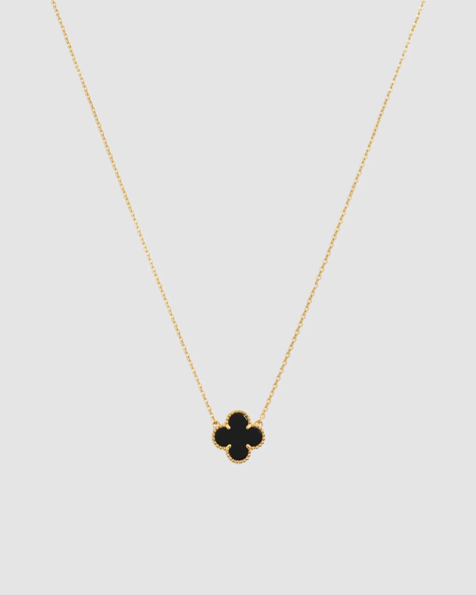 Natural Black Agate Four leaf Clover Pendant Necklace with 18k yellow gold plating and black agate charm.