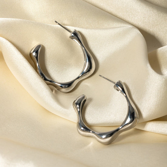 bold and glamorous hoop earring in silver colour