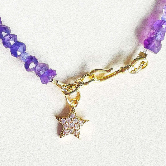 Gold filled star charm in a Amethyst bracelet.