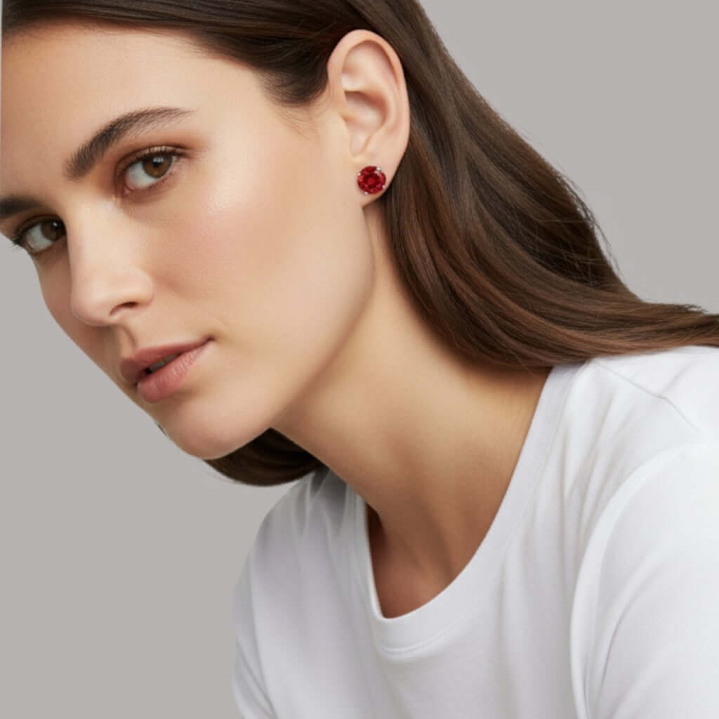 Model wearing Octagonal Rose Cut Deep Red Zircon Stud in Silver earrings, showcasing elegance and modern style.