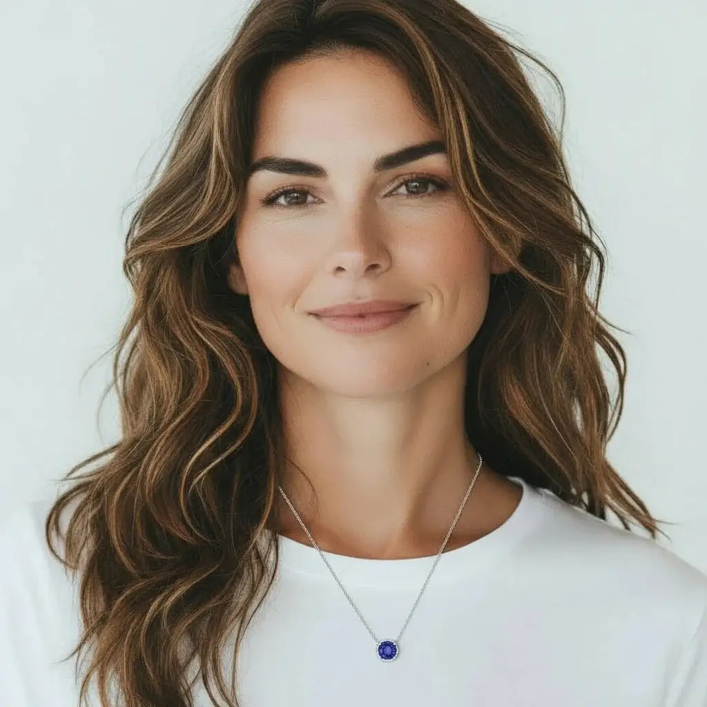 Octagonal Rose Cut Tanzanite Blue Zircon Pendant Necklace in Silver worn by a woman with long hair.