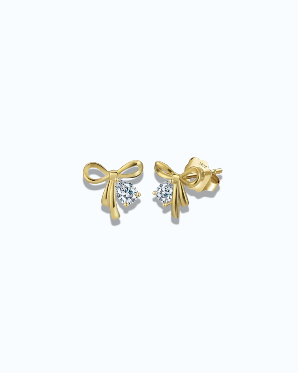 Pearlystones gold plated bowknot stud earrings with pear-shaped cubic zirconia.