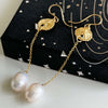 displayed a beautiful pearl earring in gold 