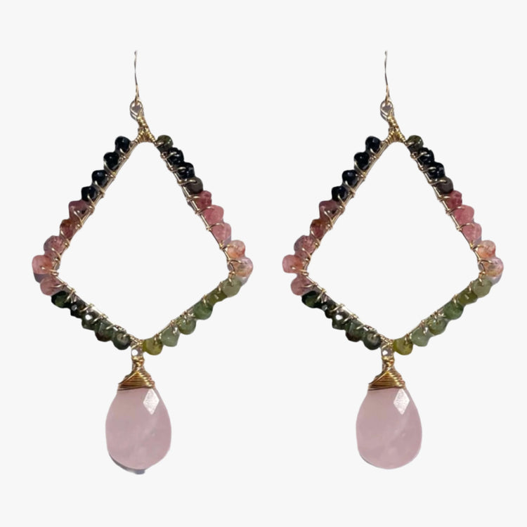 A luxurious gold earring made up of Tourmalines and rose quartz is displayed on a white background