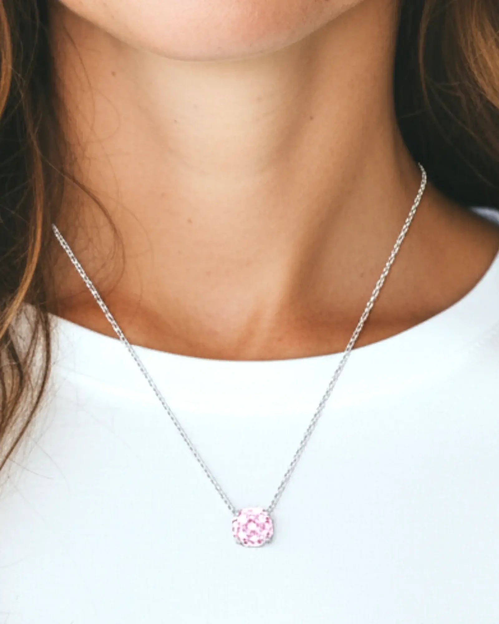 Octagonal rose cut pink zircon pendant necklace in silver worn by a model, showcasing its beautiful design.