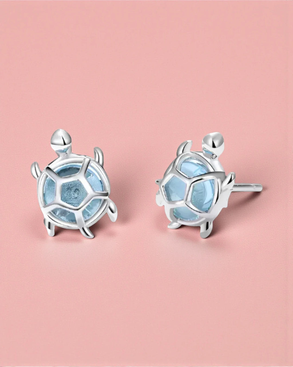 Sea Turtles Stud Earrings in Silver featuring aquatic blue glass stones and delicate silver shell design.