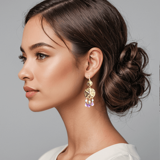 A woman wearing a stunning earring made in amethysts and turquoise gemstones.