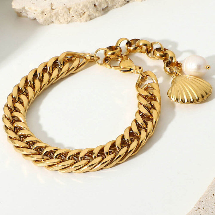 chunky gold bracelet with shell charm and freshwater pearl