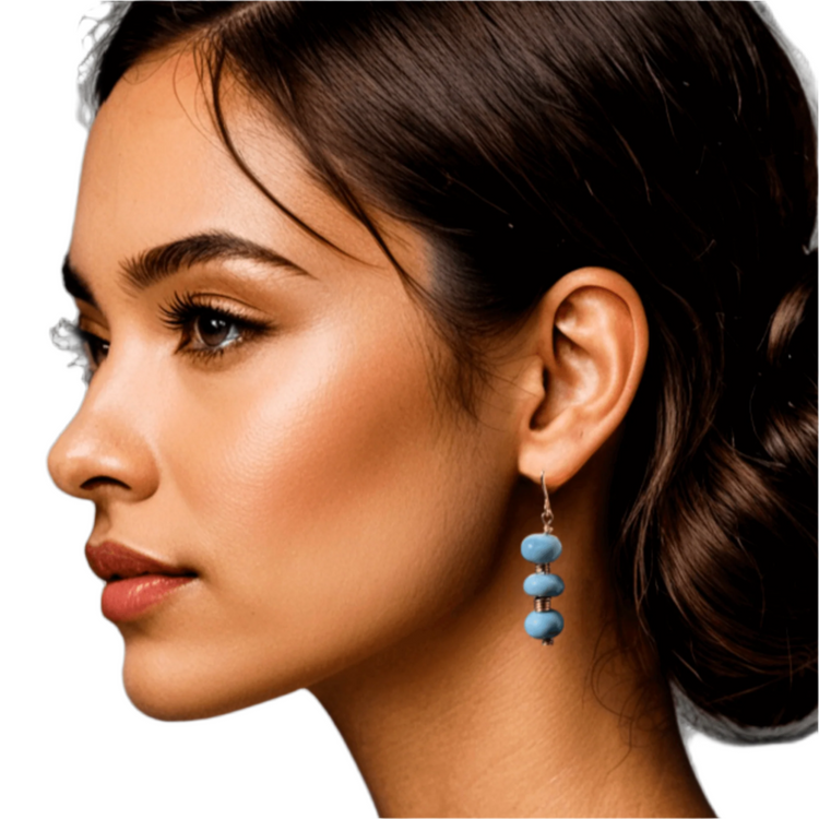 A woman wearing blue opal earring made in gold filled