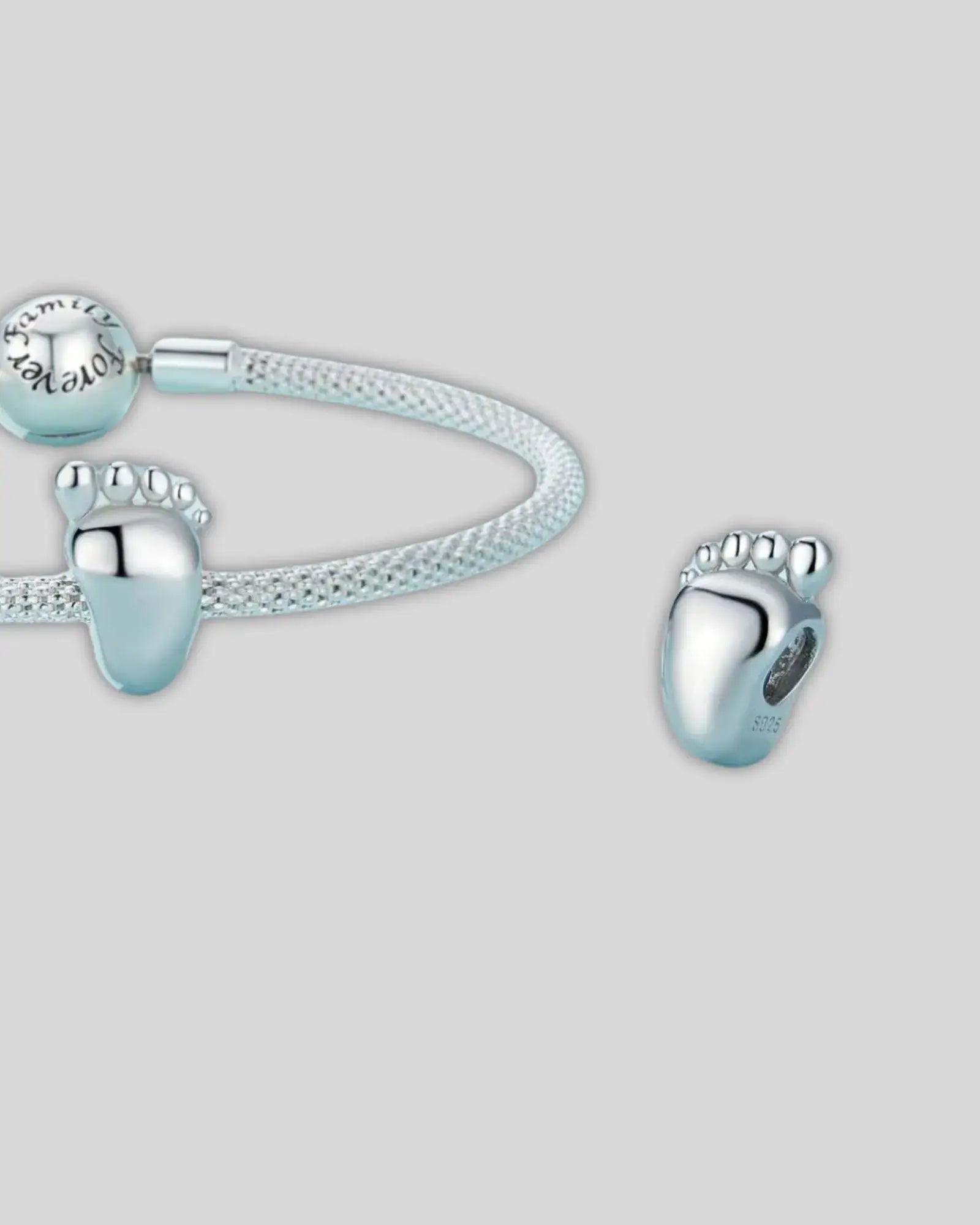 Engravable baby feet charm in 925 sterling silver, ideal for personalizing special memories in your jewelry collection.