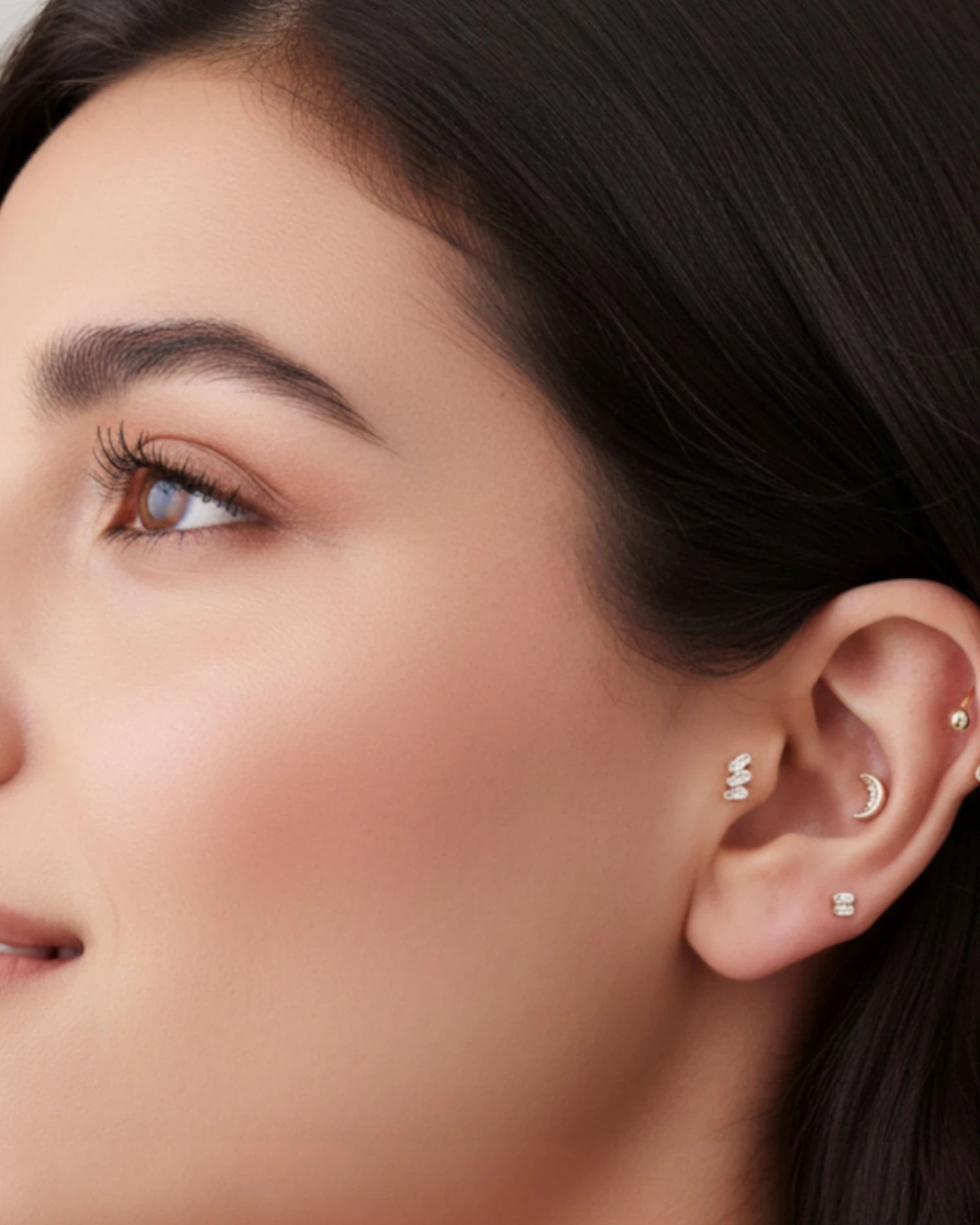 Single piece Crescent Moon Flat Back Stud showcased in a stylish ear with multiple piercings.