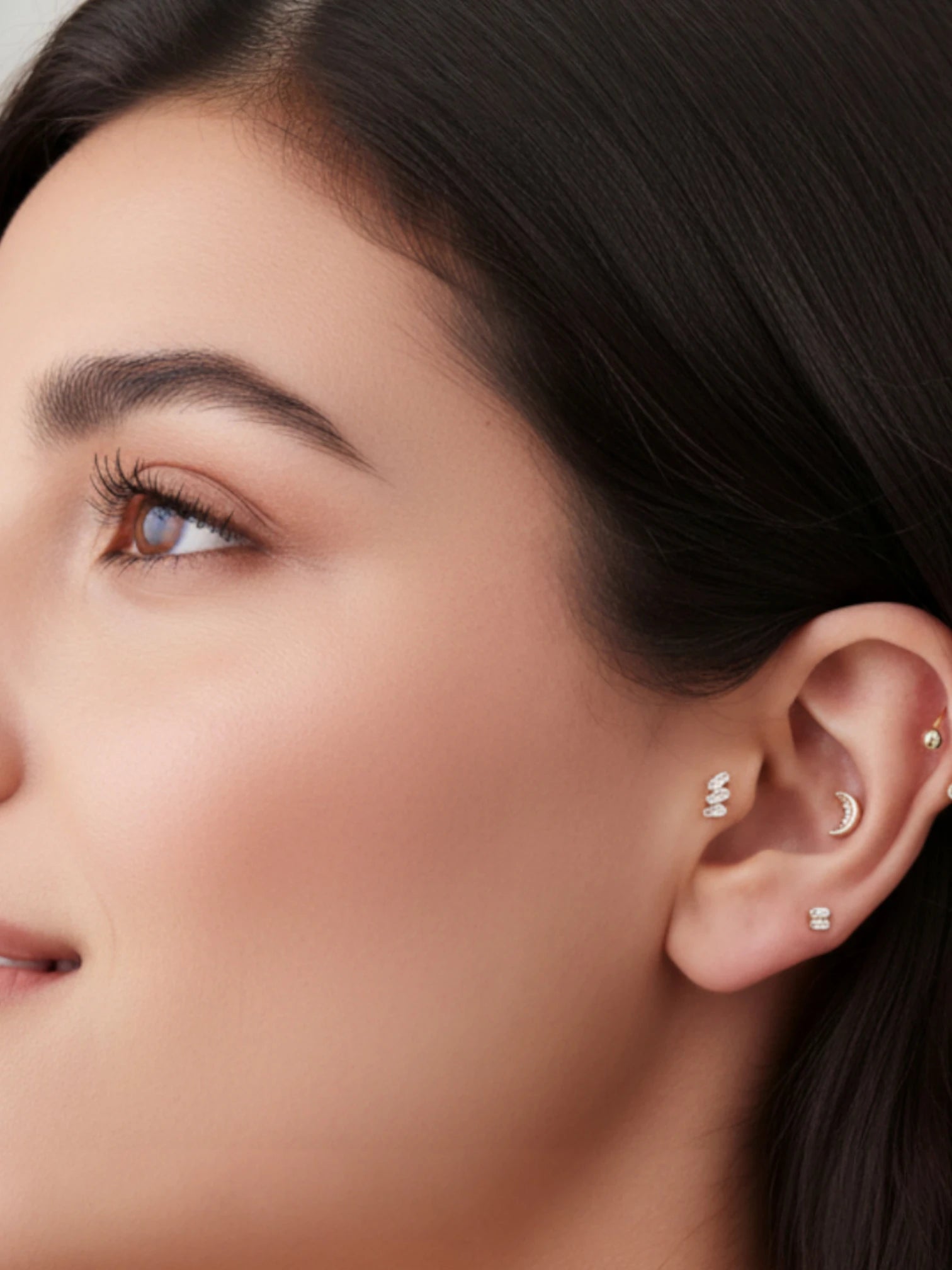 Single piece Crescent Moon Flat Back Stud showcased in a stylish ear with multiple piercings.