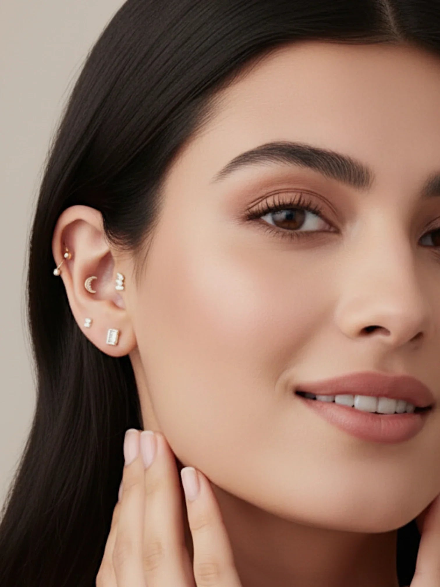 Model showcasing a collection of earrings including a Single piece Crescent Moon Flat Back Stud.