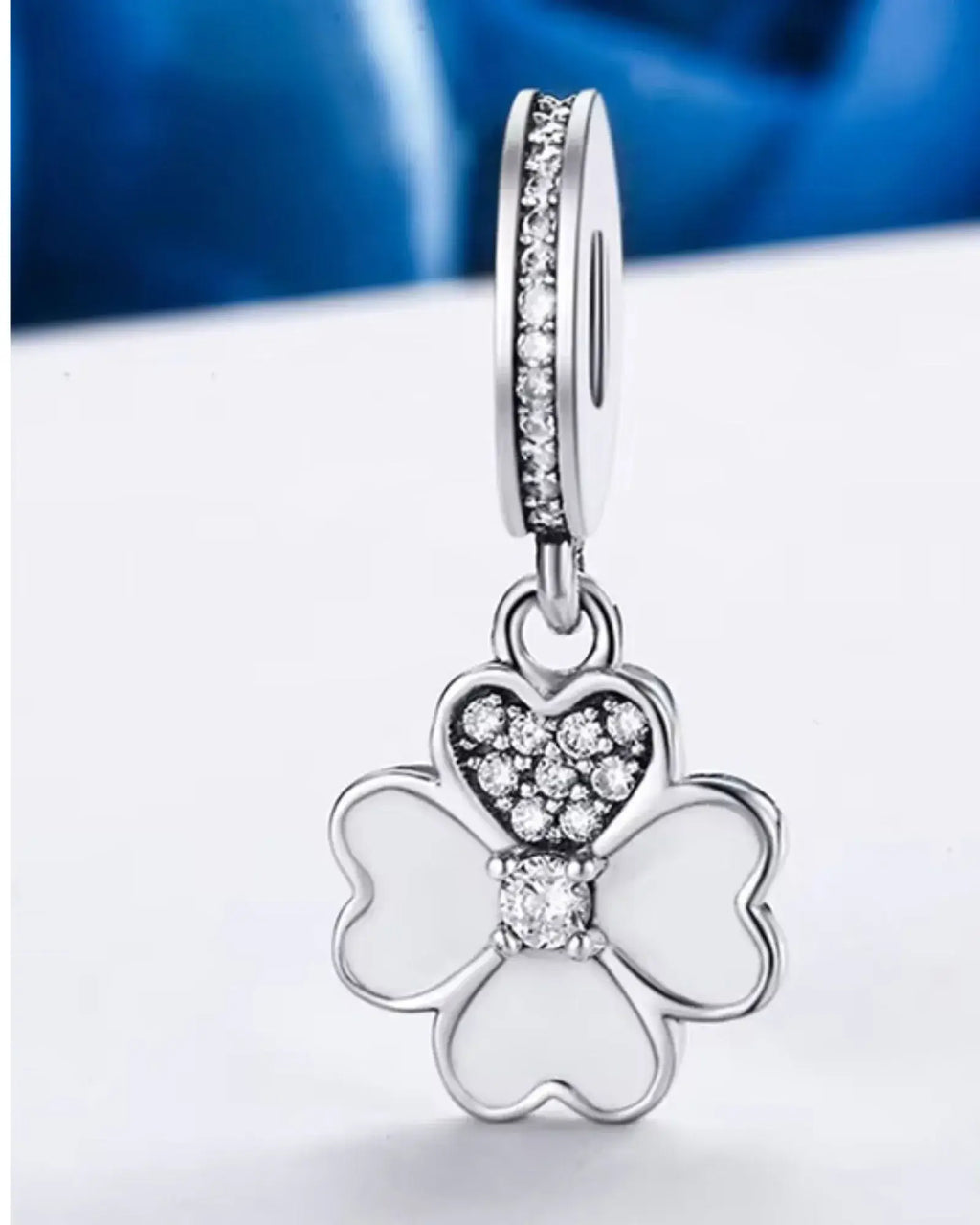 Heart Petals Clover Dangle Charm in 925 Sterling Silver with sparkling accents, perfect for adding love and luck to any accessory.