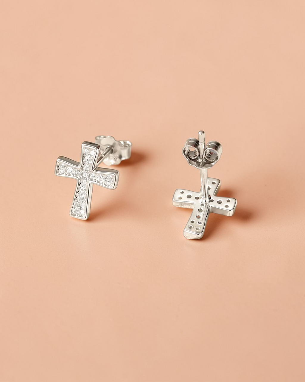 0.1 Ct Moissanite Cross Stud elegant earrings with sparkling design on a light background.
