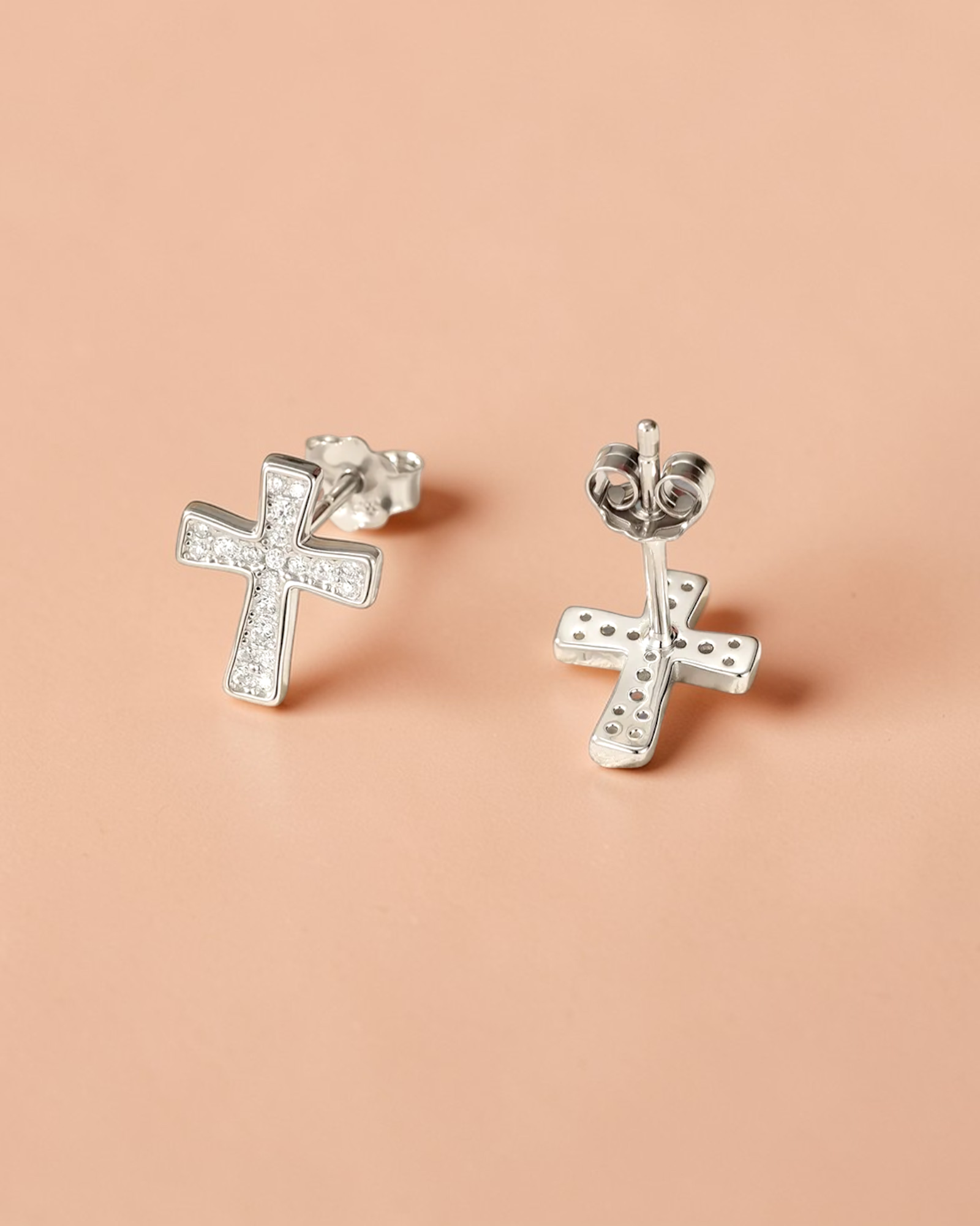 0.1 Ct Moissanite Cross Stud elegant earrings with sparkling design on a light background.