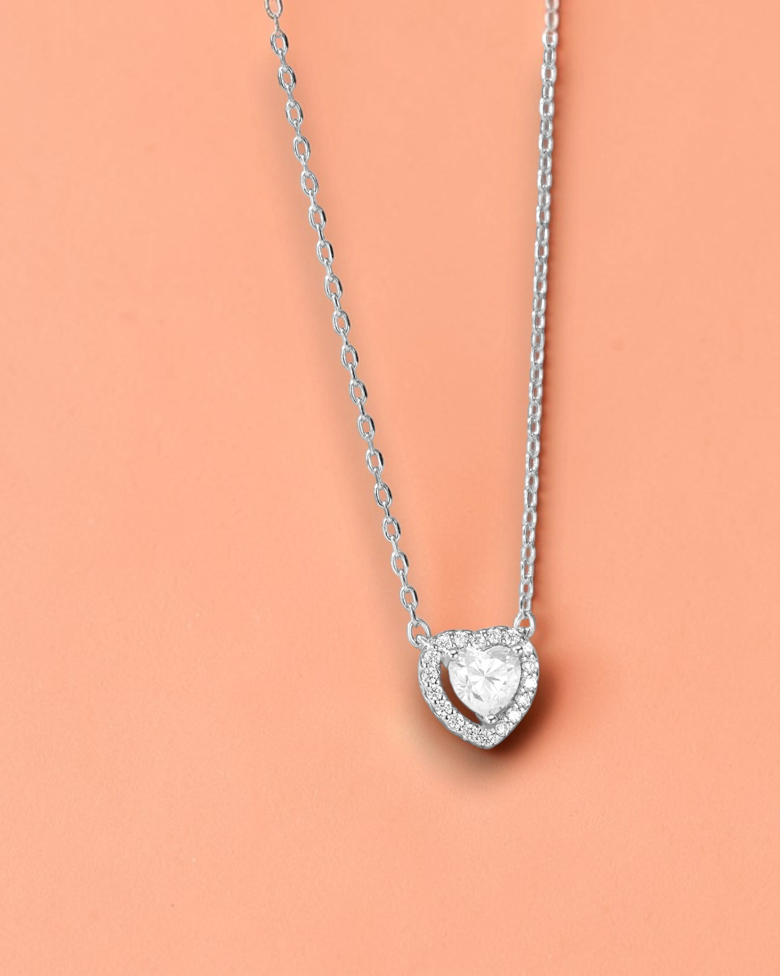 0.5 Ct Hollow heart Moissanite necklace featuring a delicate heart design in sparkling silver.
