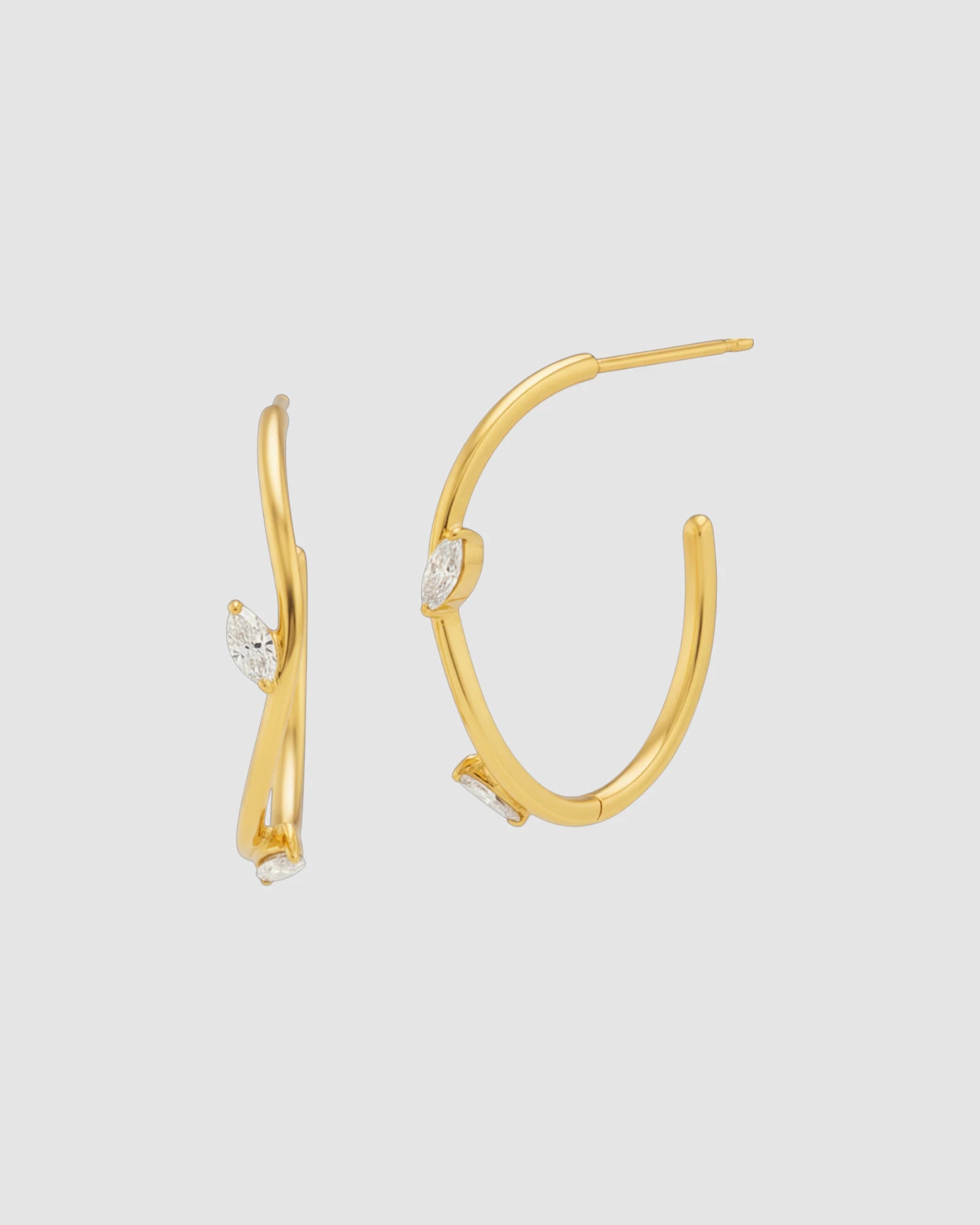 Irregular Half Hoop earring featuring gold finish and sparkling marquis-shaped zirconia stones.