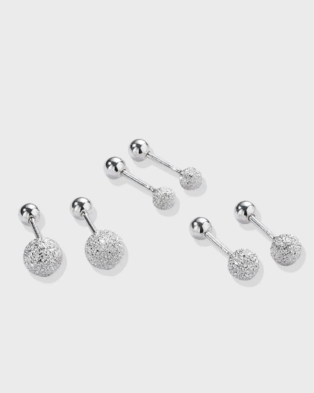 Luna Frost Ear Studs featuring silver-tone design with frosted crystal spheres for a minimalist and radiant look.