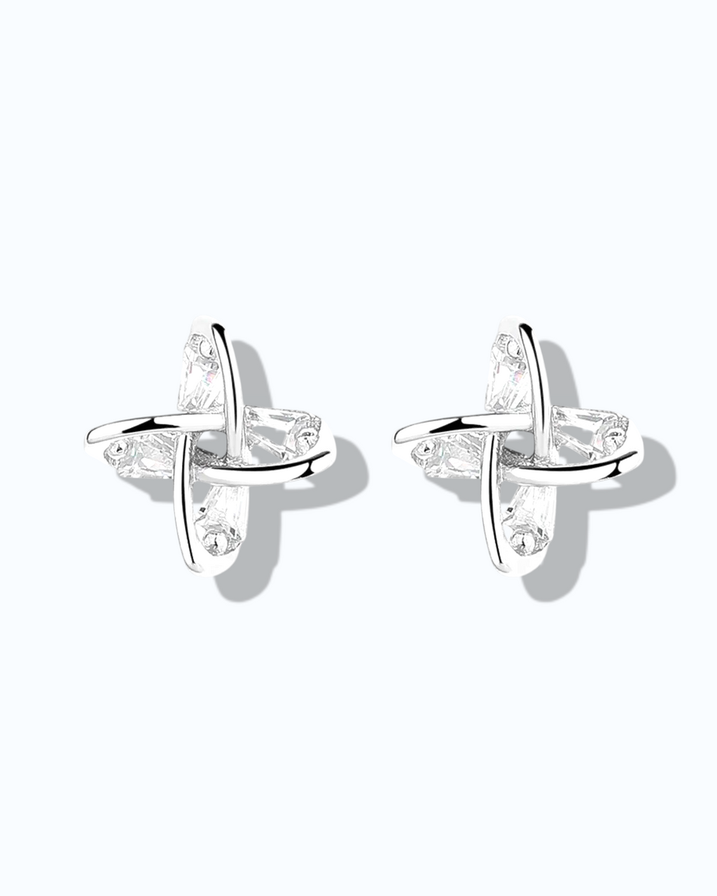 Elegant windmill design ear studs in 925 sterling silver with clear gemstones, perfect for stylish outfits.