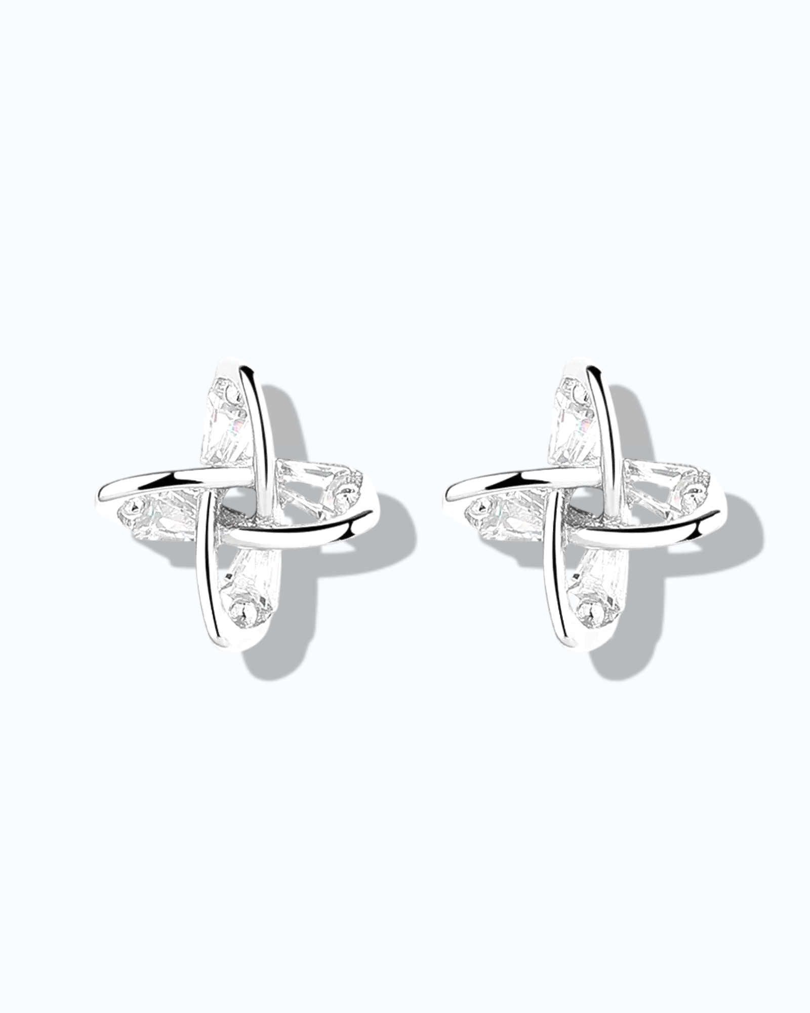 Elegant windmill design ear studs in 925 sterling silver with clear gemstones, perfect for stylish outfits.