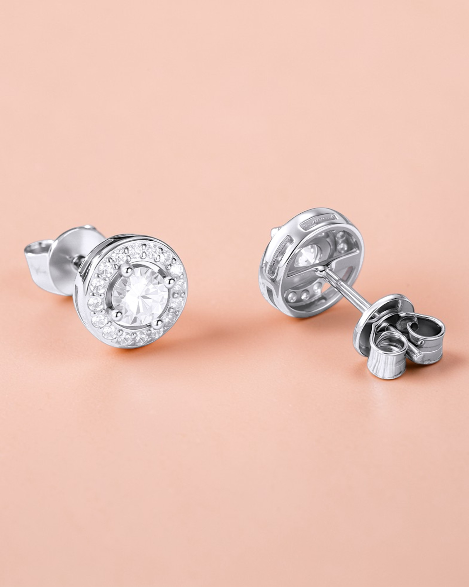 Round Brilliant Cut moissanite Stud with cubic zirconia accents in a secure four-claw prong setting.