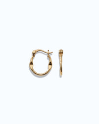Pearlstones gold molten texture medium hoop earrings with hinged creole closure.