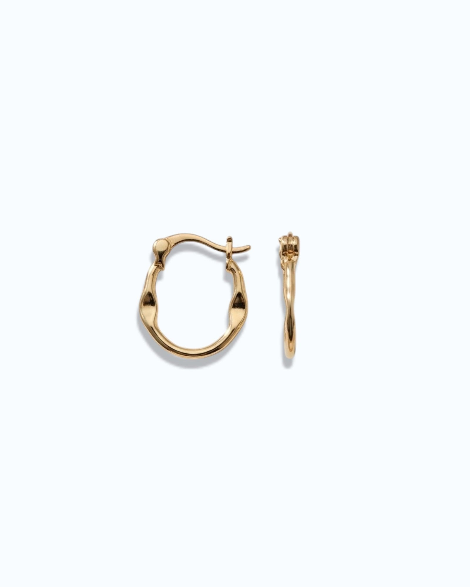 Pearlstones gold molten texture medium hoop earrings with hinged creole closure.