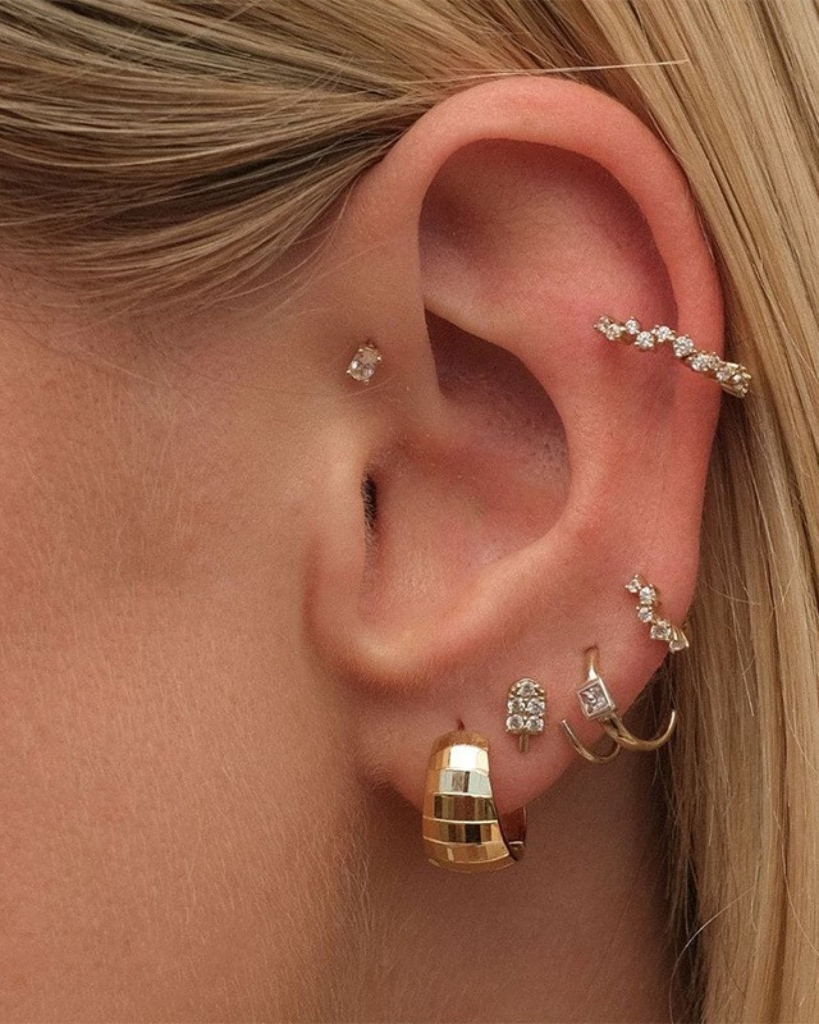Pearlstones gold-tone sterling silver huggie hoop earrings with geometric texture and diamond stud earrings.