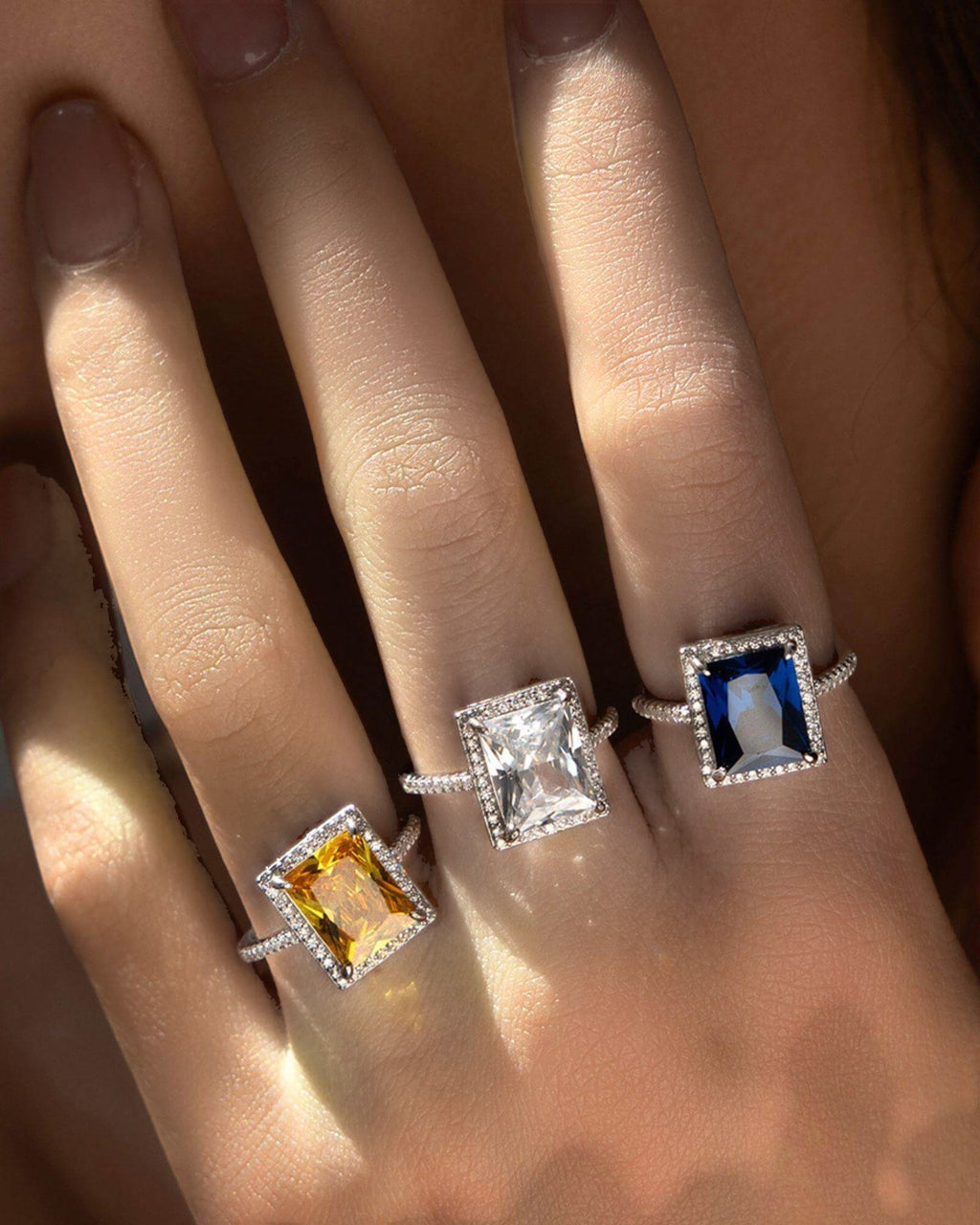 Stylish white zirconia cocktail rings featuring colorless Created Zirconium gemstones set in sterling silver.