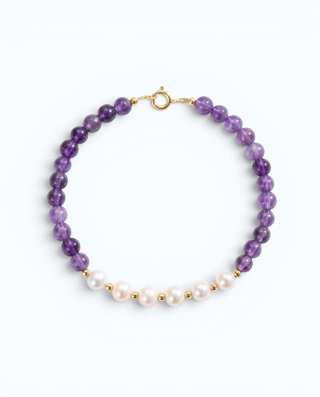 Pearlystones beaded bracelet featuring purple amethyst gemstones and white pearls with gold-toned spacers.
