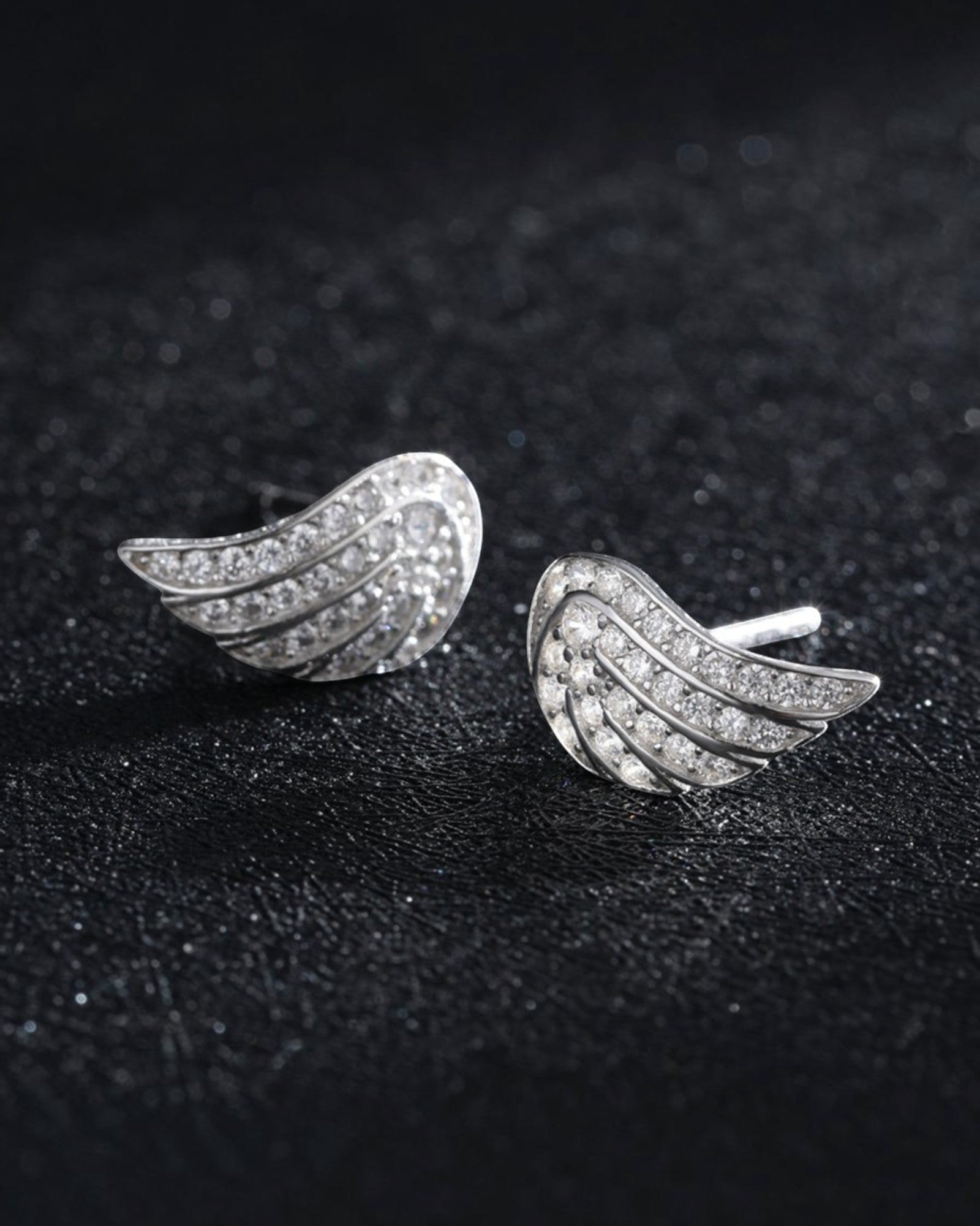 Pearlystones Angel Wing Stud Earrings with cubic zirconia in polished silver-tone metal.