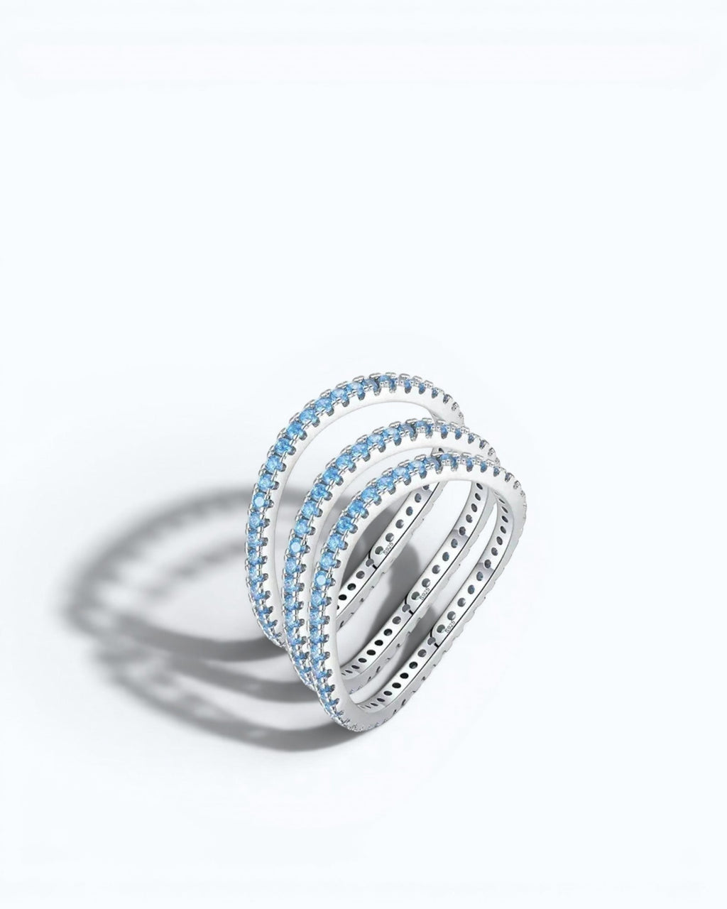Pearlystones Azure Glow sterling silver eternity band featuring a row of vibrant blue zircon stones.