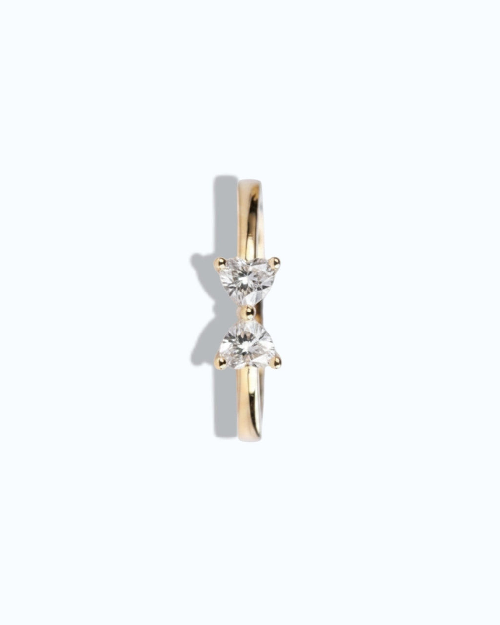 Pearlystones gold ring with two heart-shaped gemstones forming a bow shape.