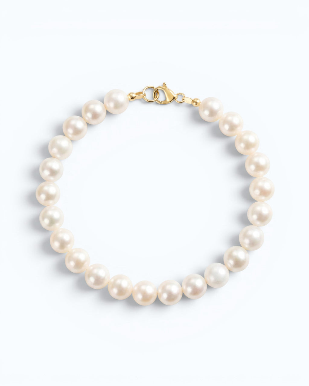 Pearlystones 14K gold plated sterling silver bracelet featuring 5-6mm nearly round natural freshwater pearls