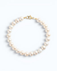 Pearlystones 14K gold plated sterling silver bracelet featuring 5-6mm nearly round natural freshwater pearls