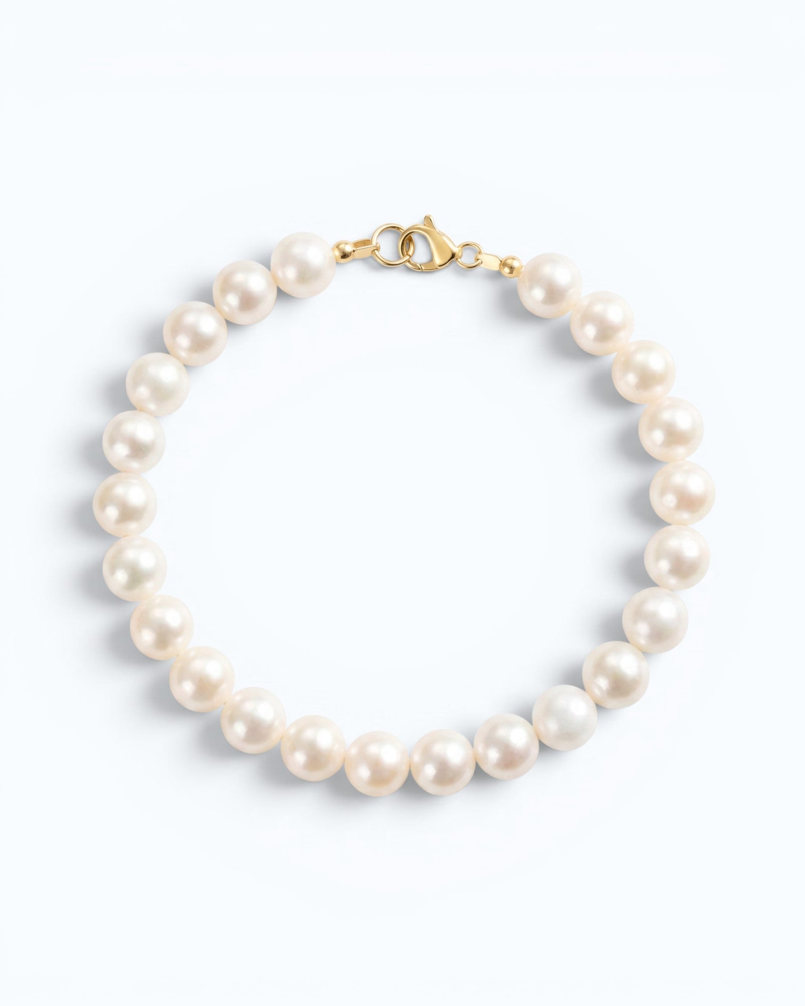 Pearlystones 14K gold plated sterling silver bracelet featuring 5-6mm nearly round natural freshwater pearls