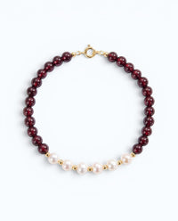 Pearlystones beaded bracelet featuring deep red garnet gemstones and white pearls with gold-toned spacers.