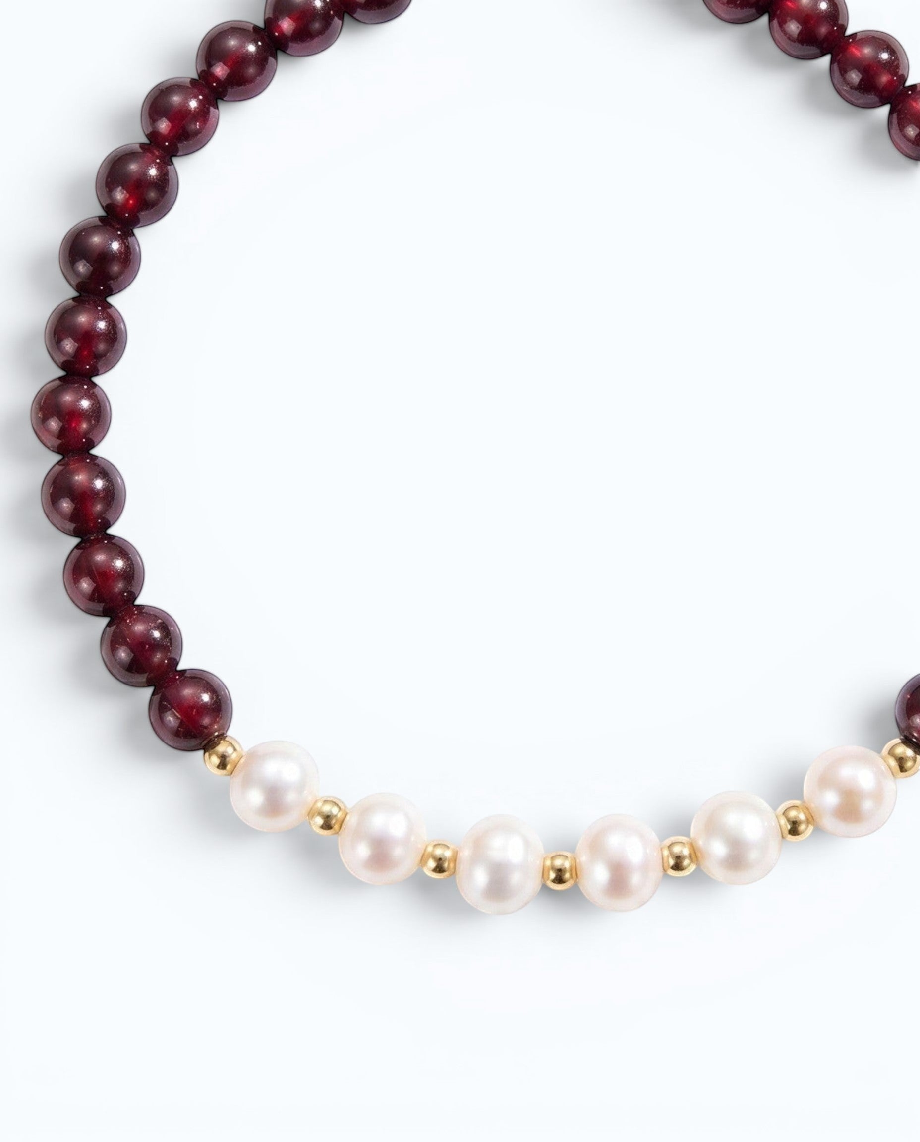 Pearlystones beaded bracelet featuring deep red garnet gemstones and white pearls with gold-toned spacers.