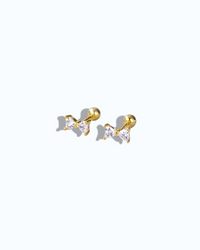 Pearlystones gold bow stud earrings with cubic zirconia and ball screw back.