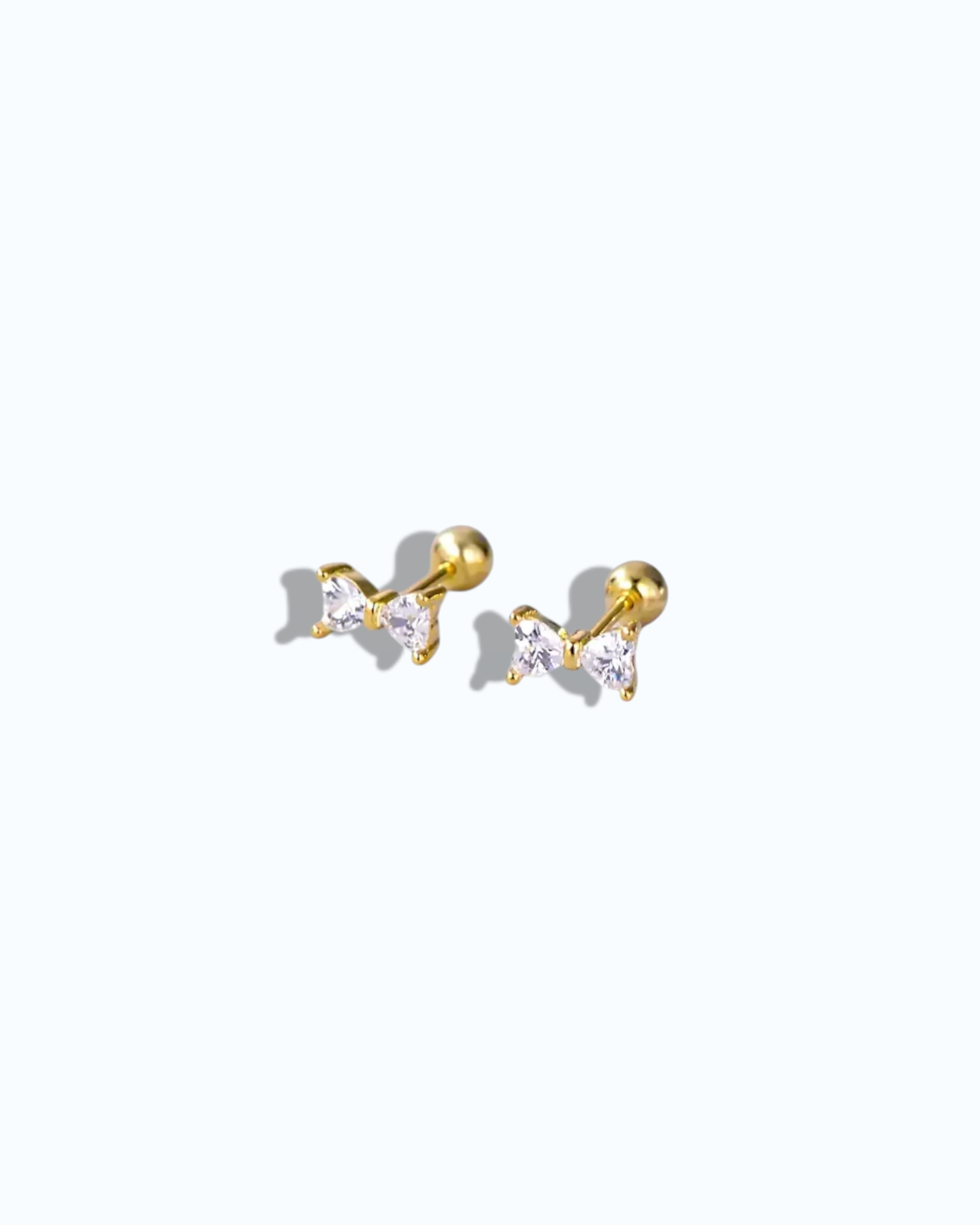 Pearlystones gold bow stud earrings with cubic zirconia and ball screw back.